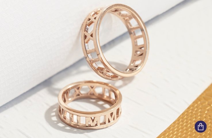Zlaté snubní prsteny s římskými písmeny