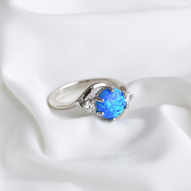 Stříbrný prsten s modrým opálem a zirkony 84701