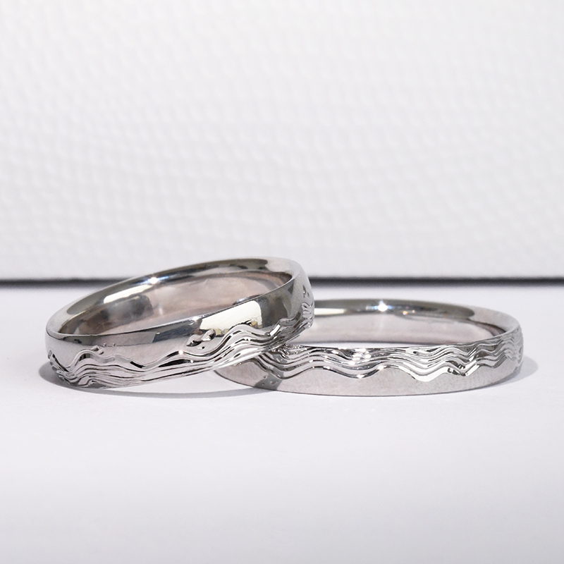 Snubní prsteny s ruční rytinou vln a diamanty Laurien 116994