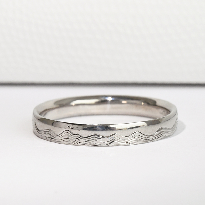 Snubní prsteny s gravírem vln a diamanty Laurien 116995