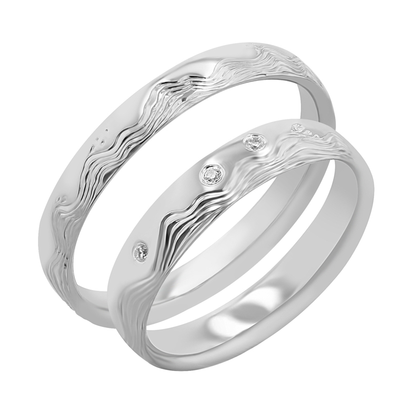 Snubní prsteny s ruční rytinou vln a diamanty Laurien