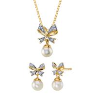 Kolekce perlových šperků se zlatými mašlemi a zirkony Cheryl