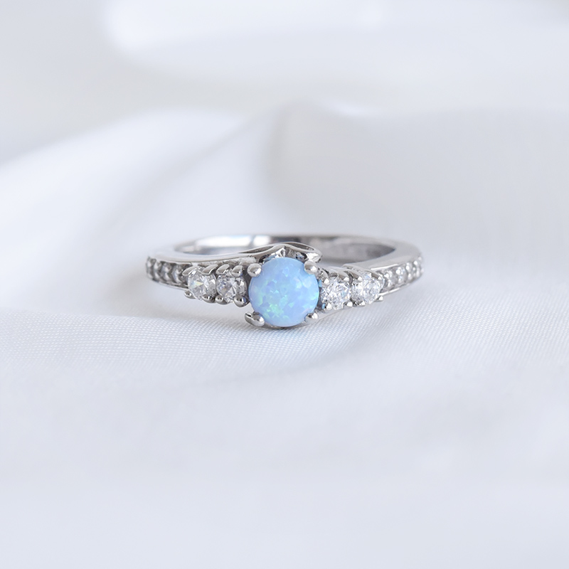 Stříbrný prsten s modrým opálem a zirkony 93499